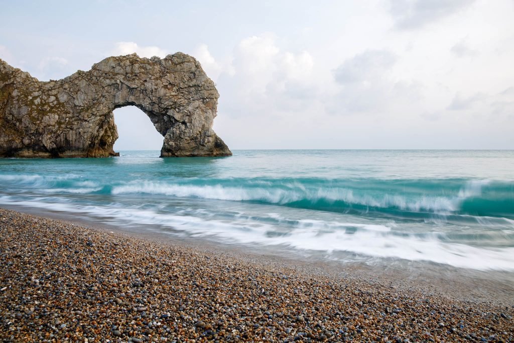 View of Durdle Door beach, Dorset, England. Durdle door is one of the many stunning locations to visit on the Jurassic coast in southern England.