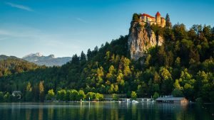 Lake Bled and the hilltop castle with the Julian Alps in the background, Slovenia.