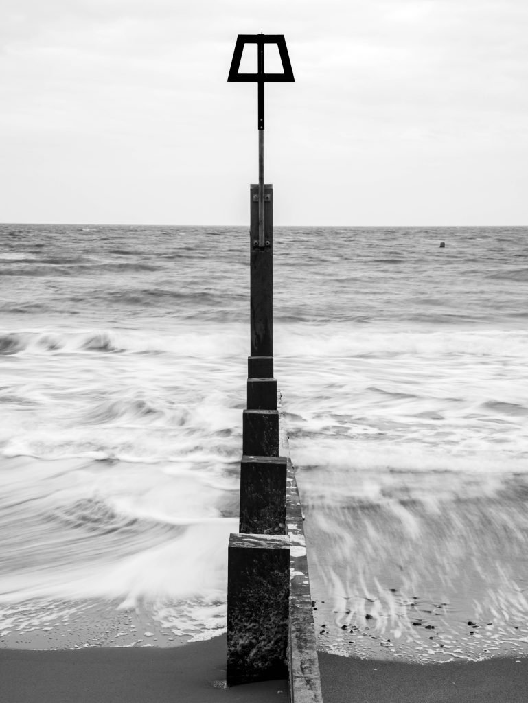 Black and white shot of Bournemouth groyne, Dorset, England