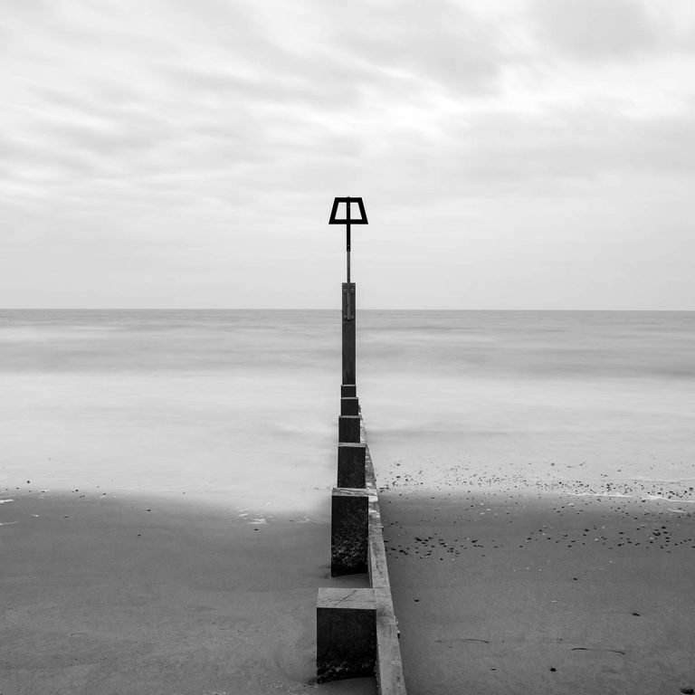 Bournemouth beach and groyne in black and white, Dorset, England