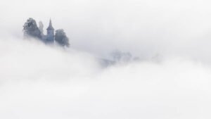 Sveti Tomaz nad Praprotnim (church of Saint Thomas) in the mist, Slovenia.