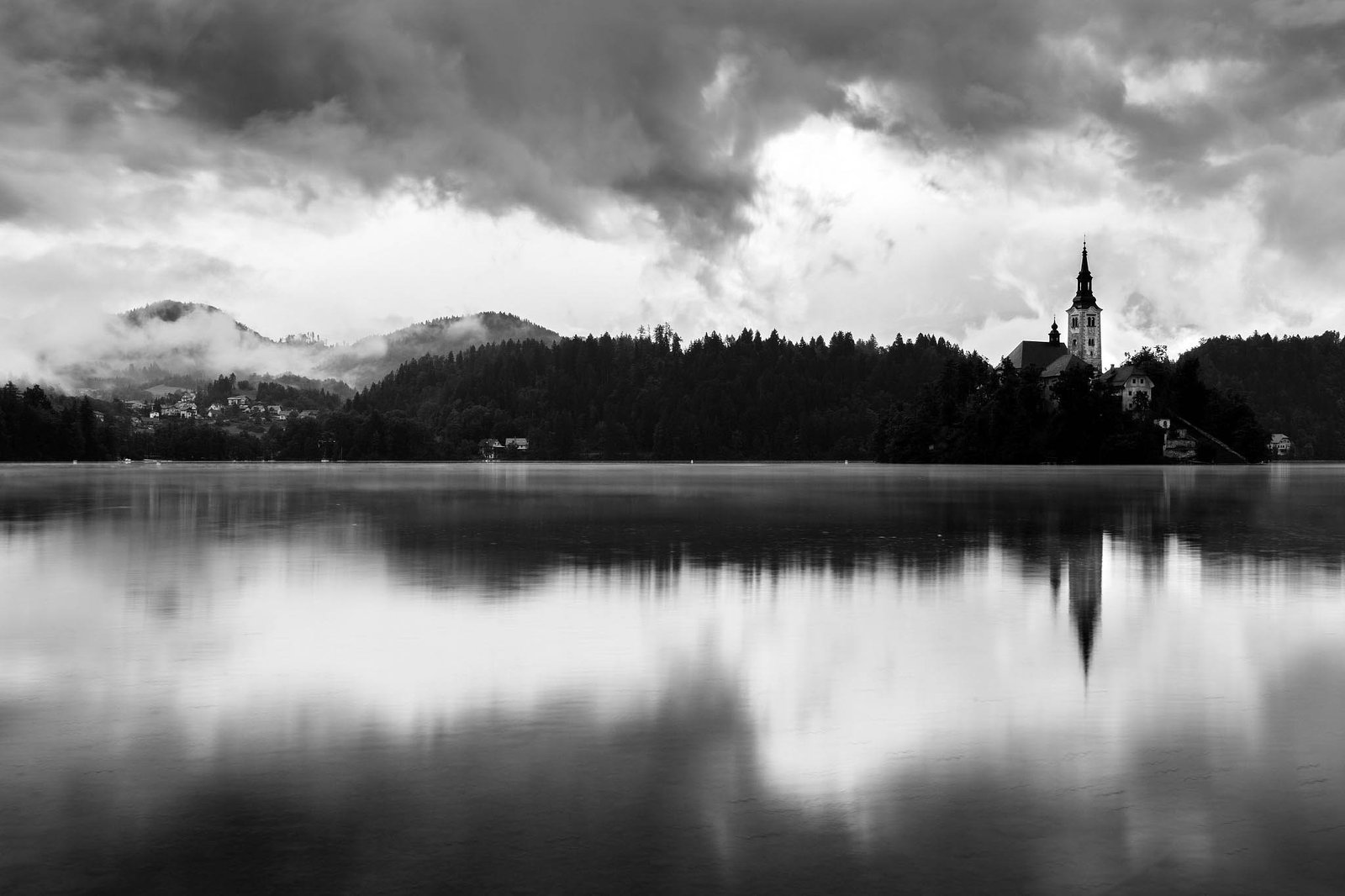 Morning at Lake Bled's island church of the assumption of saint mary after a night of heavy summer rain, Slovenia.