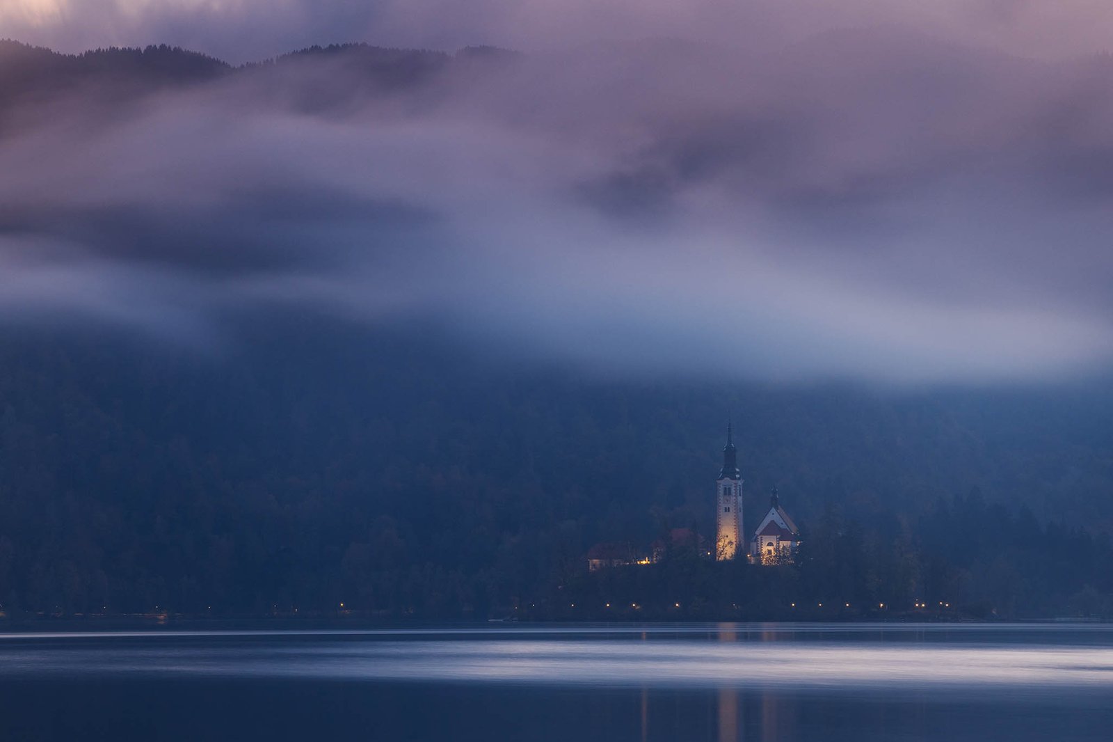 View across the beautiful Lake Bled, island church at sunset, Slovenia. Lake Bled is Slovenia's most popular tourist destination.