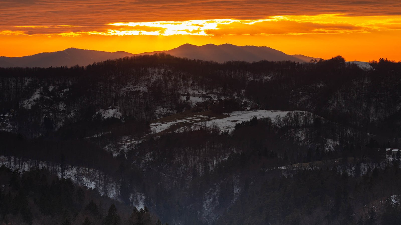 View across to Krim mountain at sunset, seen from a hill in Prezganje in the hills to the east of Ljubljana, Slovenia