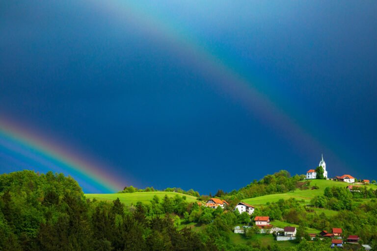 Double rainbow over the church of Saint Margaret (Sveta Marjeta) in Prezganje with the village of Volavlje in the foreground. This is in the hills to the east of Ljubljana, Slovenia