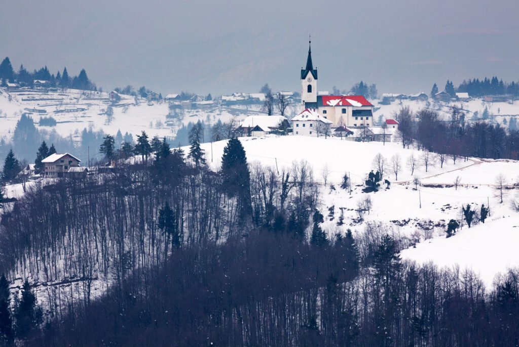 Winter scene of the church of Saint Margaret (Sv. Marjeta) in Prezganje to the east of Ljubljana, Slovenia.