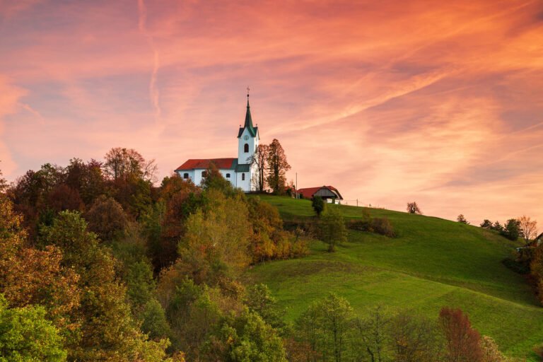 Sunset over the church of Saint Margaret (Marjeta) in Prezganje in the hills to the east of Ljubljana, Slovenia.