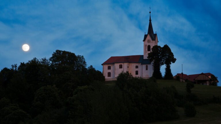 The 2013 supermoon rises beside the church of Saint Marjeta (Sveta Marjeta) in Prezganje in the Jance hills to the east of Ljubljana, Slovenia. This was shot on the evening of June 22nd, the night before totality and the moon was approximately 98% full.